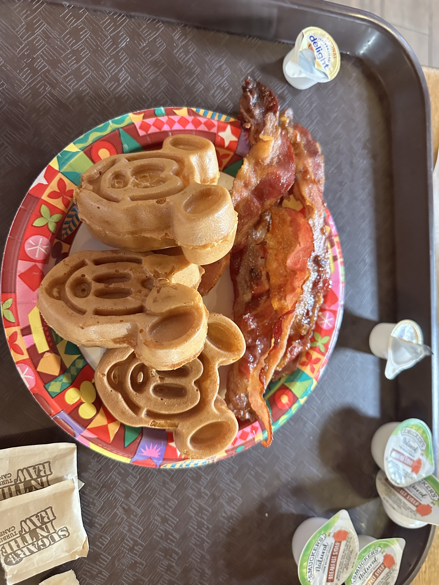 Mickey-shaped waffles and bacon