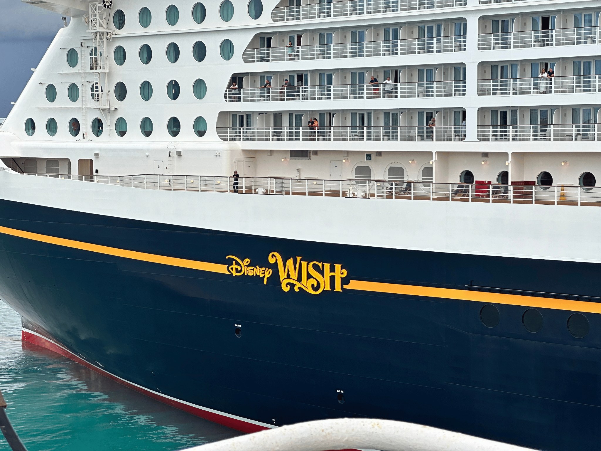 Disney Wish cruise ship showing its navy hull and balconies